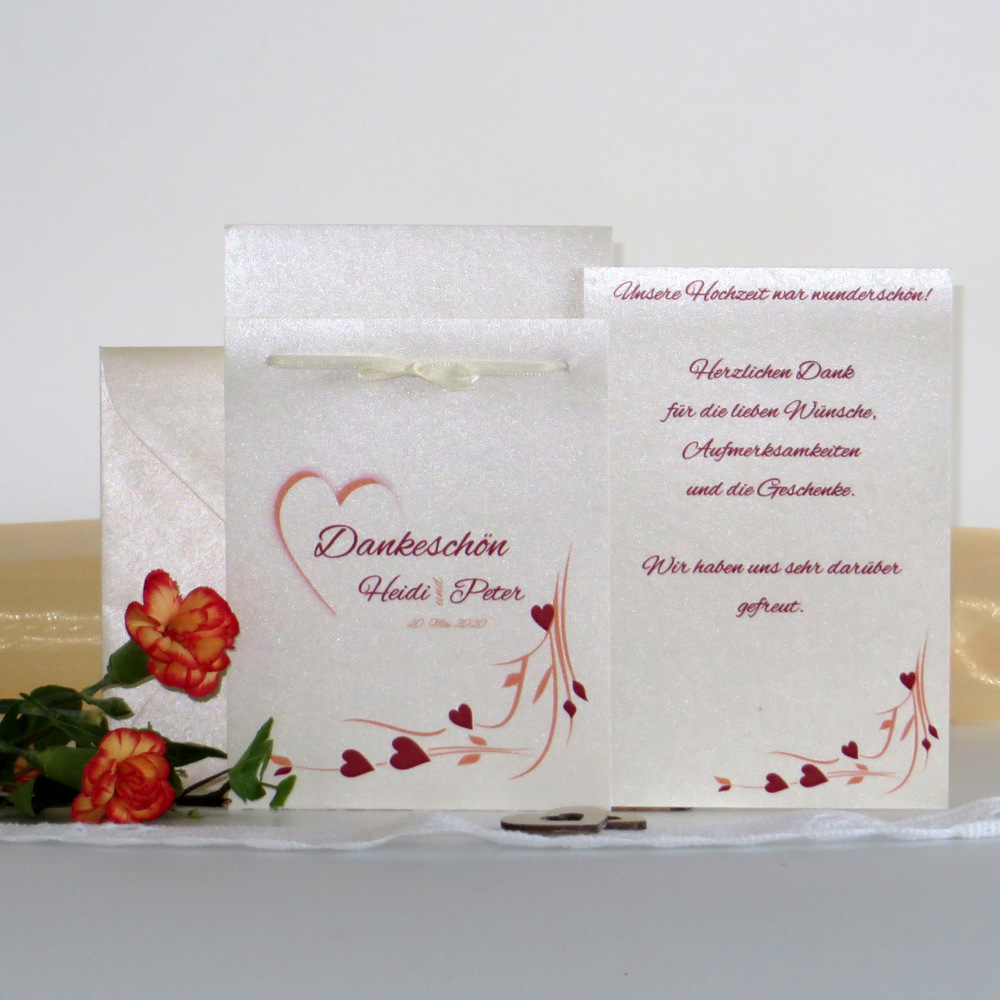 Dankeskarte nach der Hochzeit in creme mit rot und orange. Dankeskarte nach der Hochzeit in creme mit rot und orange.
