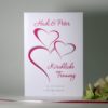 Stilvolles Liedheft mit schwungvollen Herzen in pink.