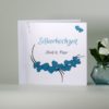 Einladung zur Silberhochzeit in frischem türkis mit zarten Herzen.
